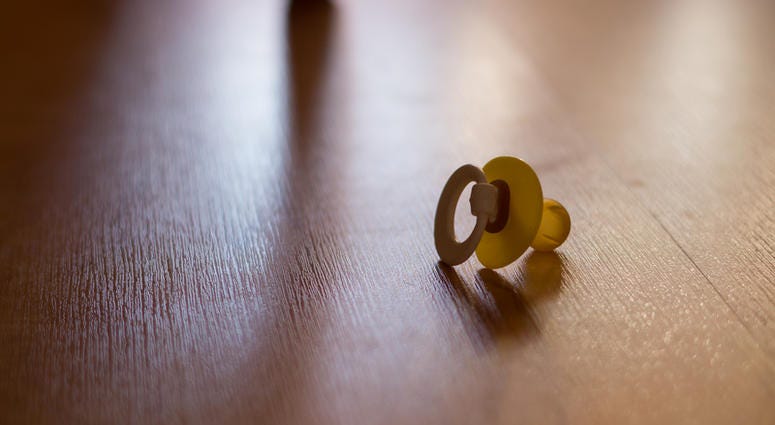 pacifier on floor pacifier on floor